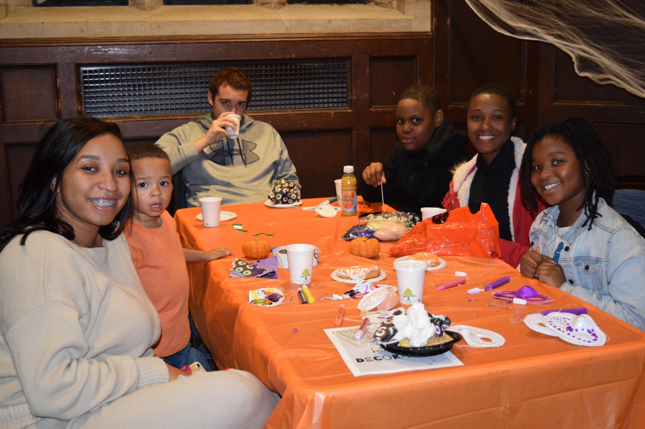 Members of the Penn Community pose for a picture while enjoying Halloween treats